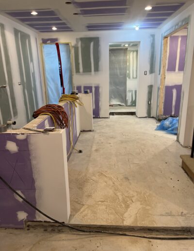 A room that is being remodeled with purple and white paint